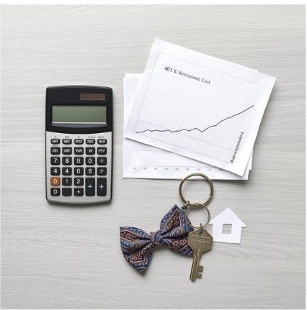 Calculator and retirement growth charts beside house keys, illustrating the long-term cost of borrowing from retirement savings to buy a home.